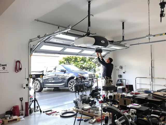 Copley Garage Door Repair specialist installing smart garage door opener system in Copley home