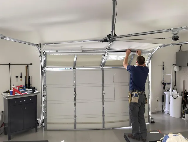 Copley Garage Door Repair specialist performing precise section replacement on Copley garage door